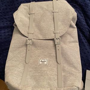 Brand new with our tags Herschel backpack. Grey in colour.